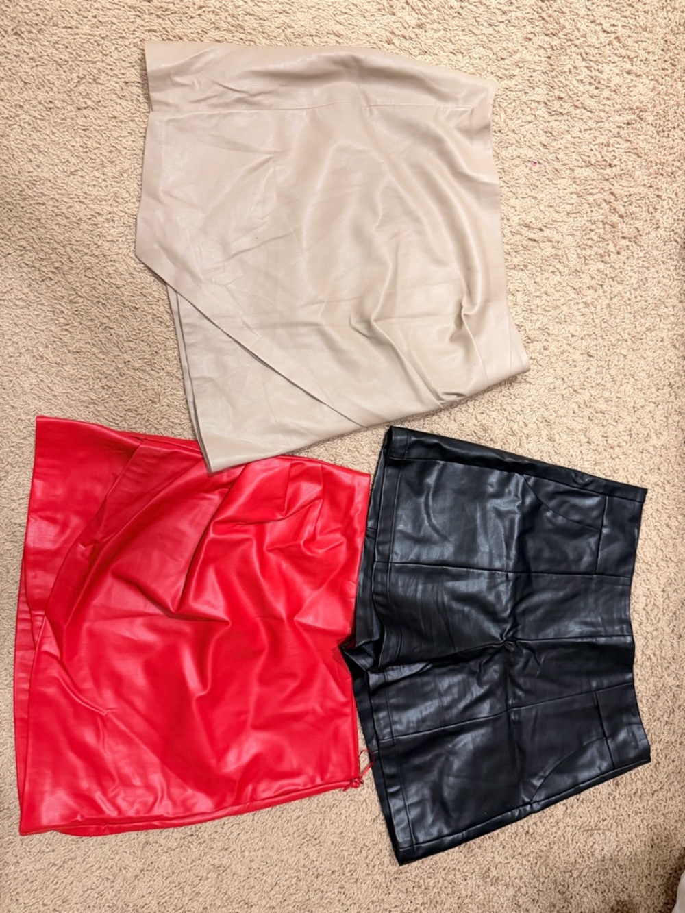 Mini fake leather skirts